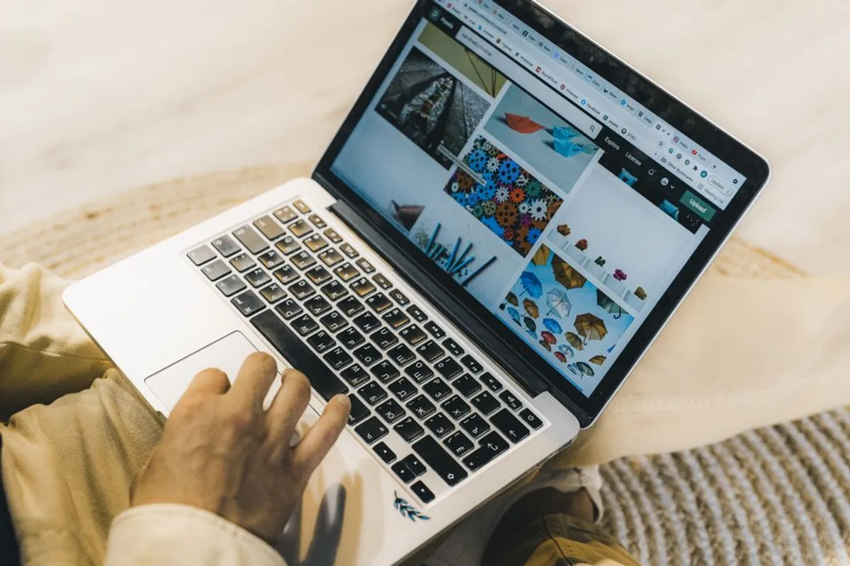 Person searching online for a therapist on a laptop