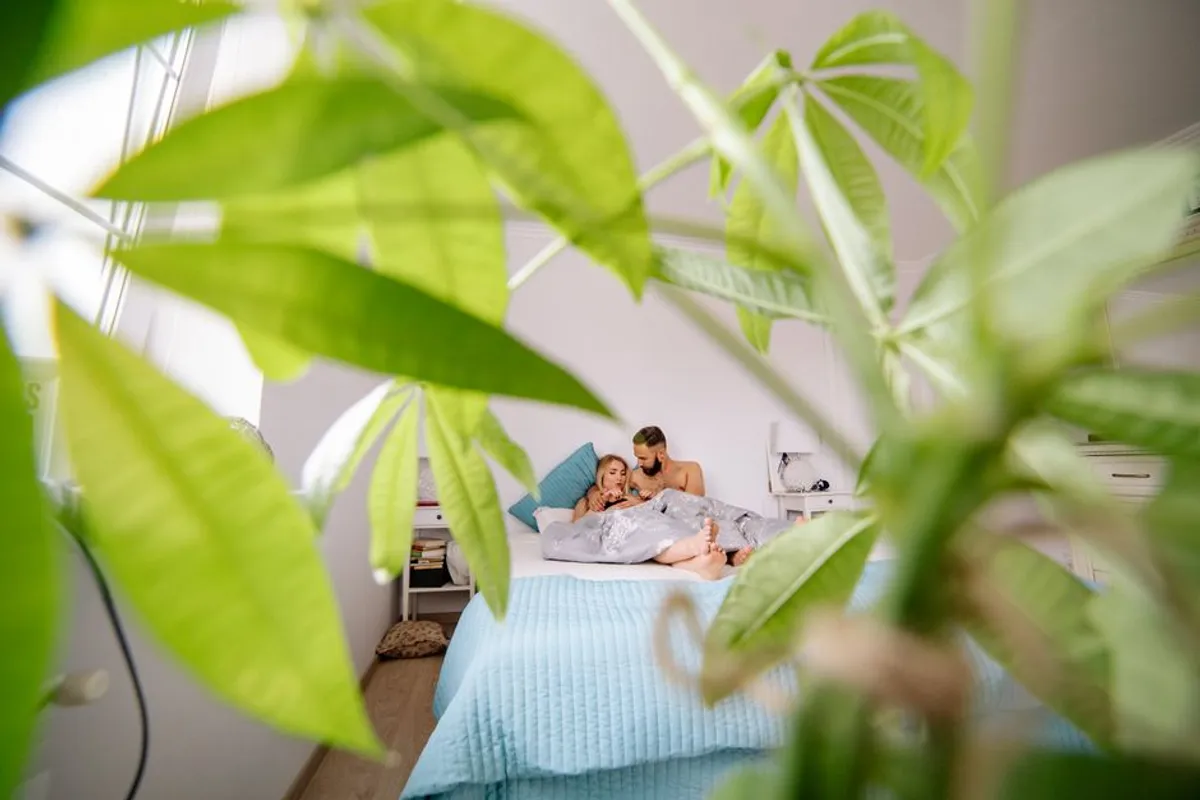 Couple in a calm bedroom in soft morning light
