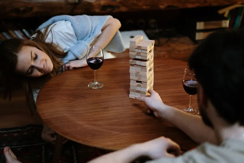 Couple relaxed together at home on a game night