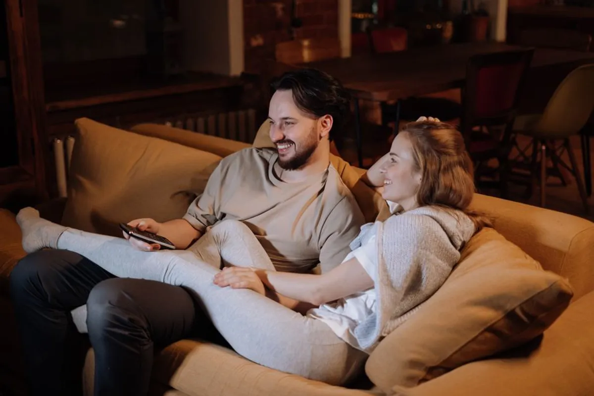 Couple sharing a warm, relaxed moment together at home in the evening