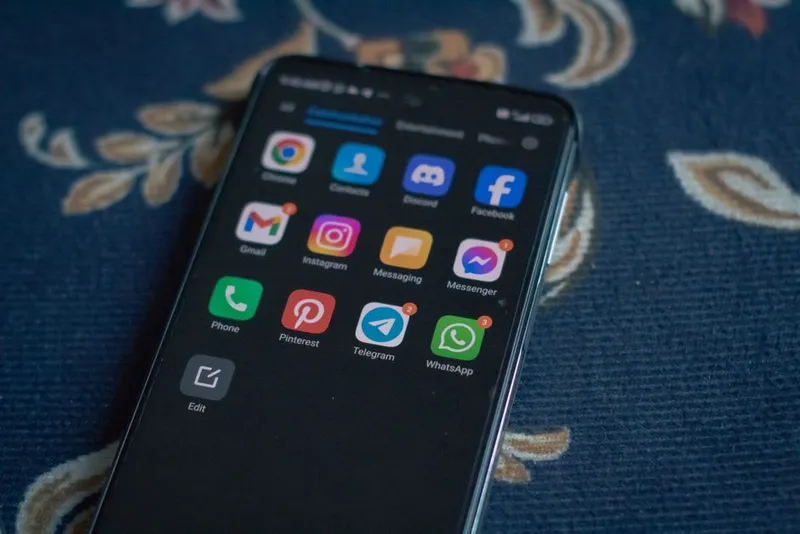 Smartphones resting on a table in a warm home setting