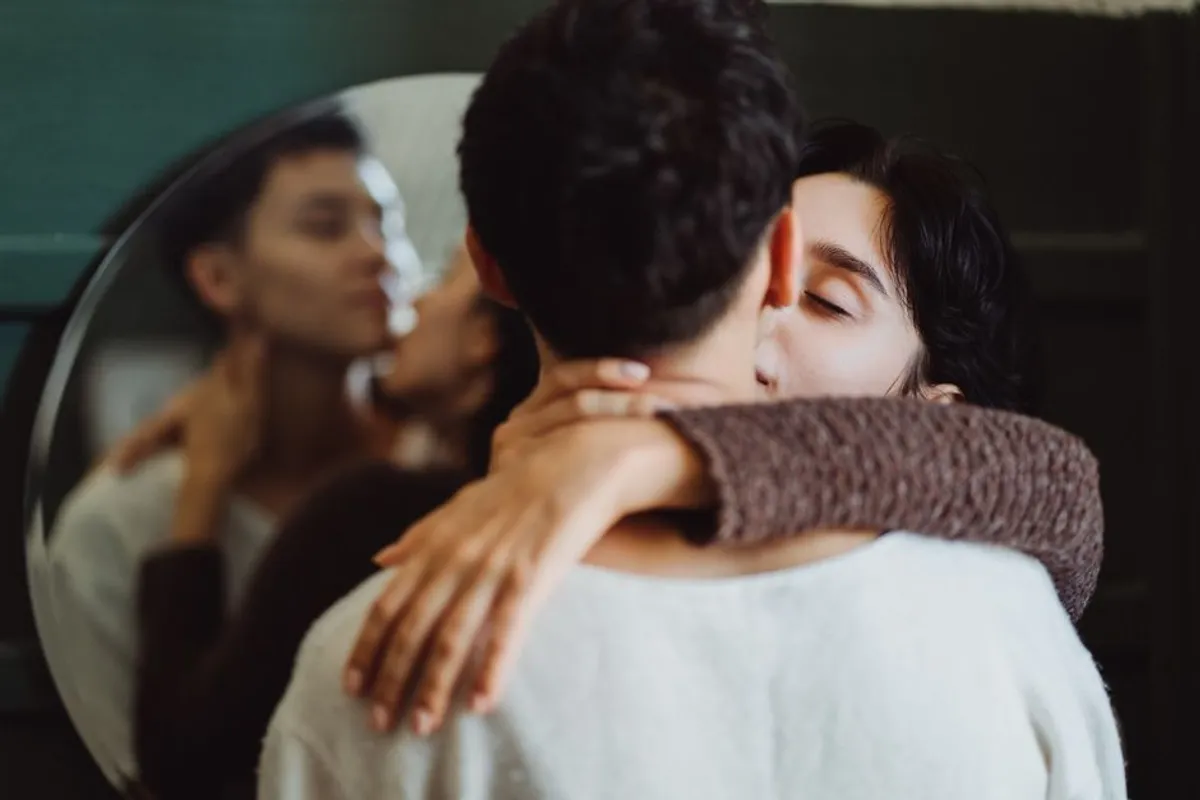 Couple embracing warmly indoors
