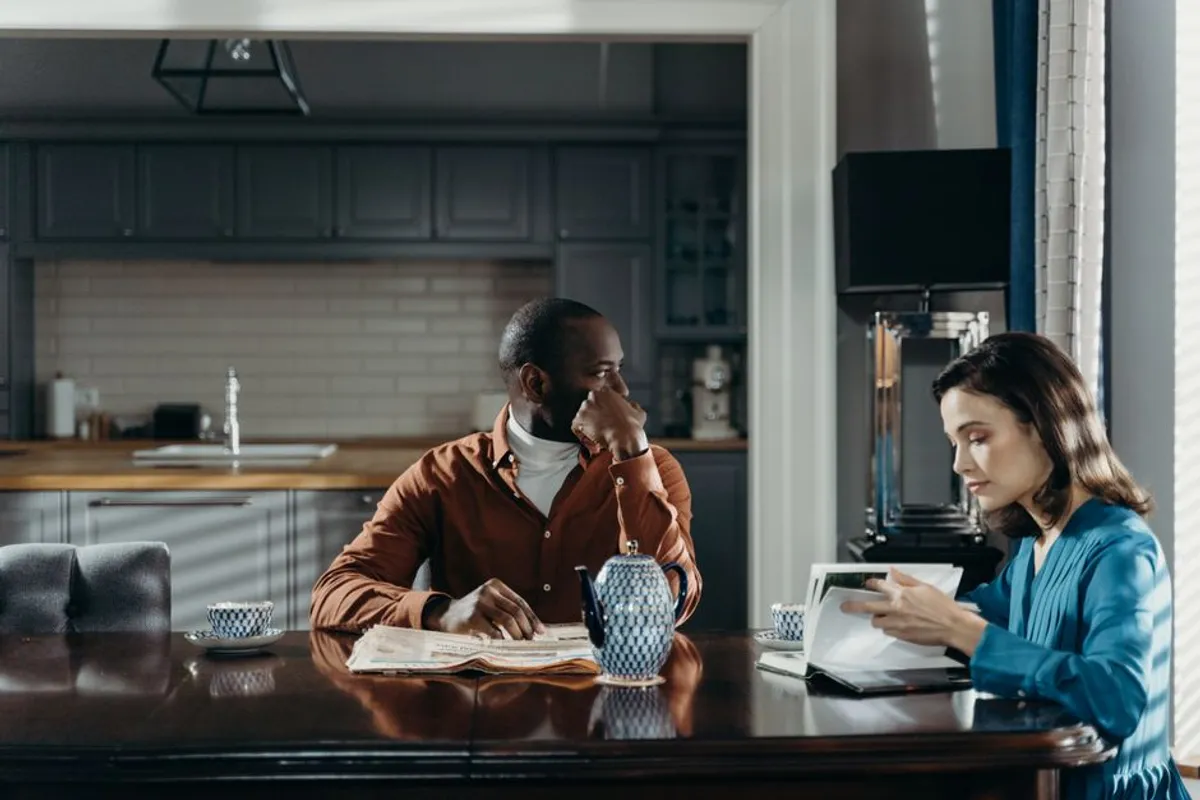 Couple having a calm conversation at a kitchen table