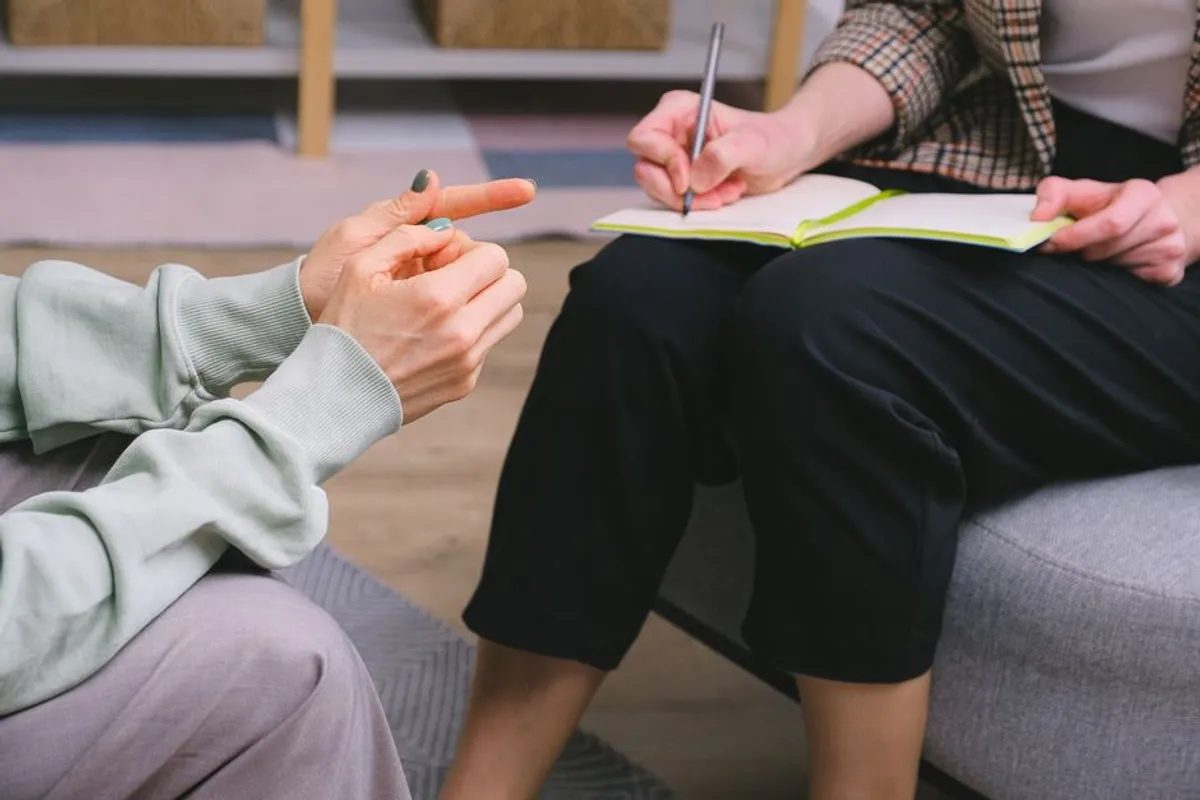 Therapist with a notebook in a professional office