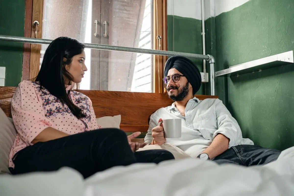 Couple in a warm, honest conversation at home