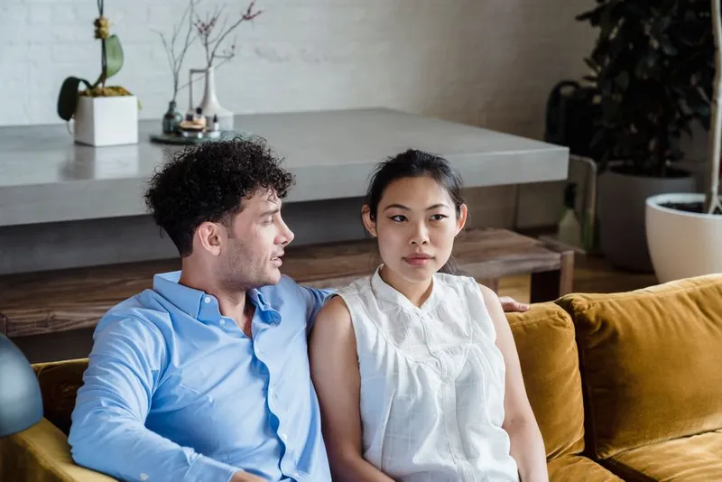 Couple in a curious, honest conversation together at home