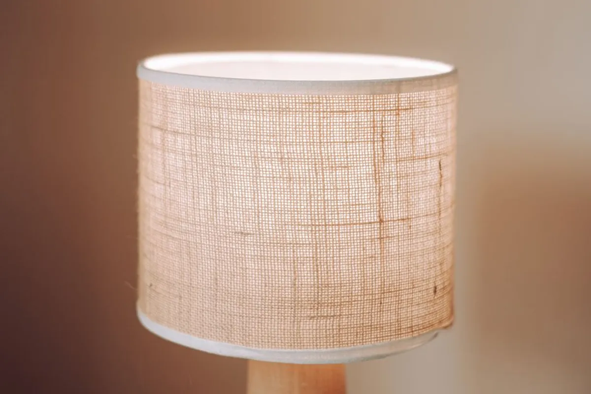 Couple close together in warm, gentle bedside light